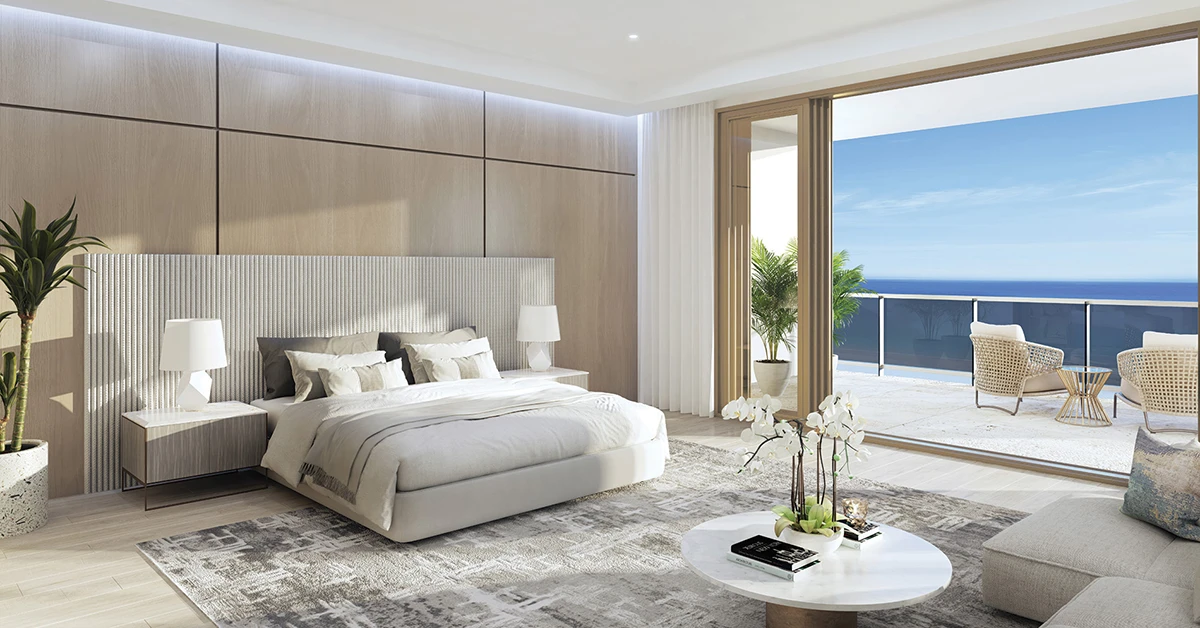Modern bedroom with ocean-view balcony and large bed