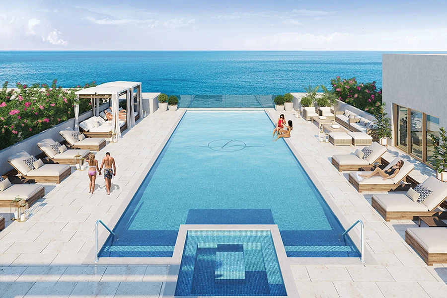 Rooftop pool with ocean view and lounge seating