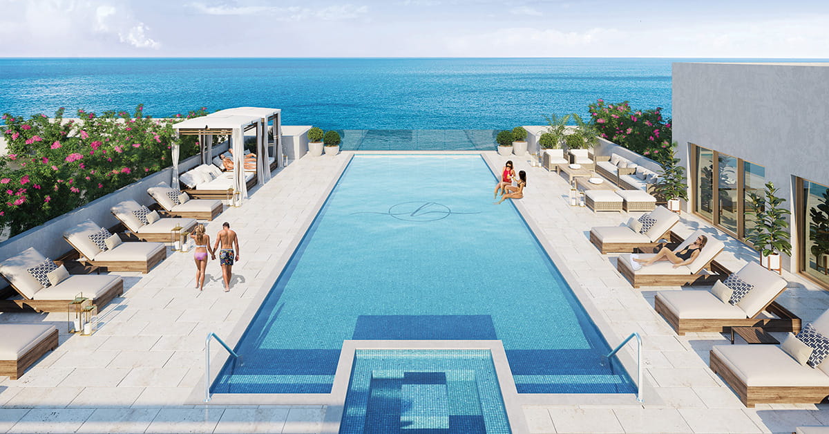Rooftop pool with ocean view and lounge seating