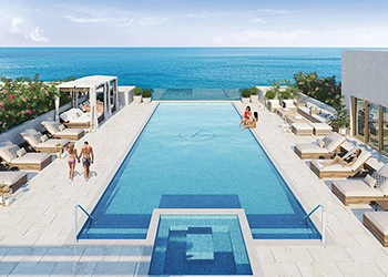 Rooftop pool with ocean view and lounge seating